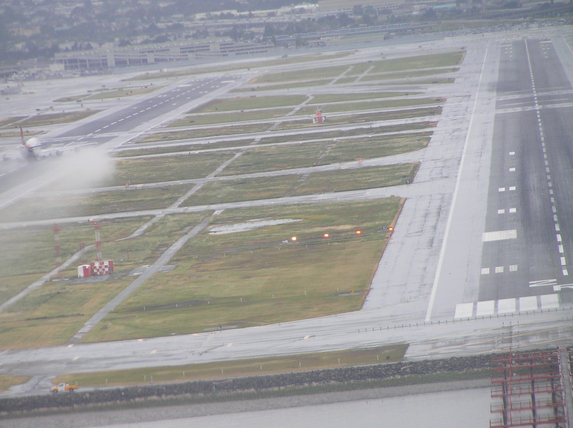A view from the pilot seat of Langley Flying School's Piper Seneca during final approach to San Franciso's west-bound twin runways.  This photo was taken during an Multi-engine Excursion Training Flight.